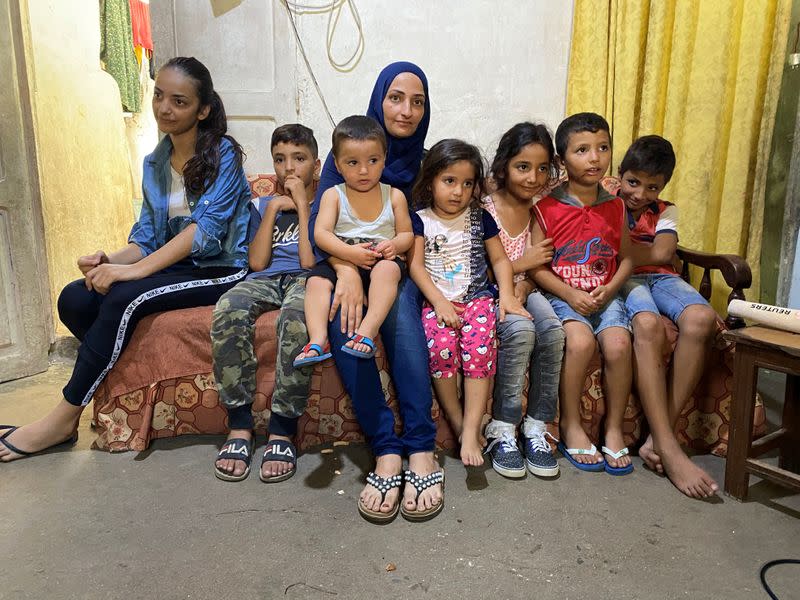 Mohammed Ghandour's wife and children are pictured inside a room in Tripoli