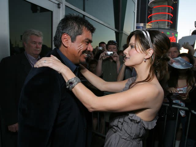 <p> E. Charbonneau/WireImage</p> George Lopez and Sandra Bullock