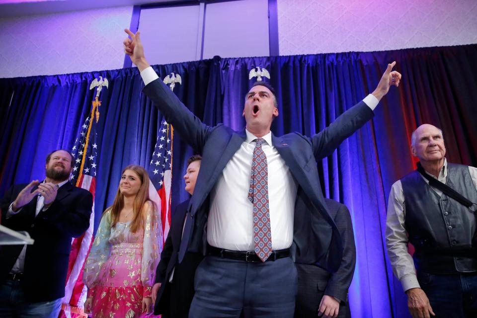 Gov. Kevin Stitt celebrates as he takes stage Tuesday night during a GOP election night watch party in Oklahoma City to speak to a crowd after winning the Oklahoma gubernatorial race.