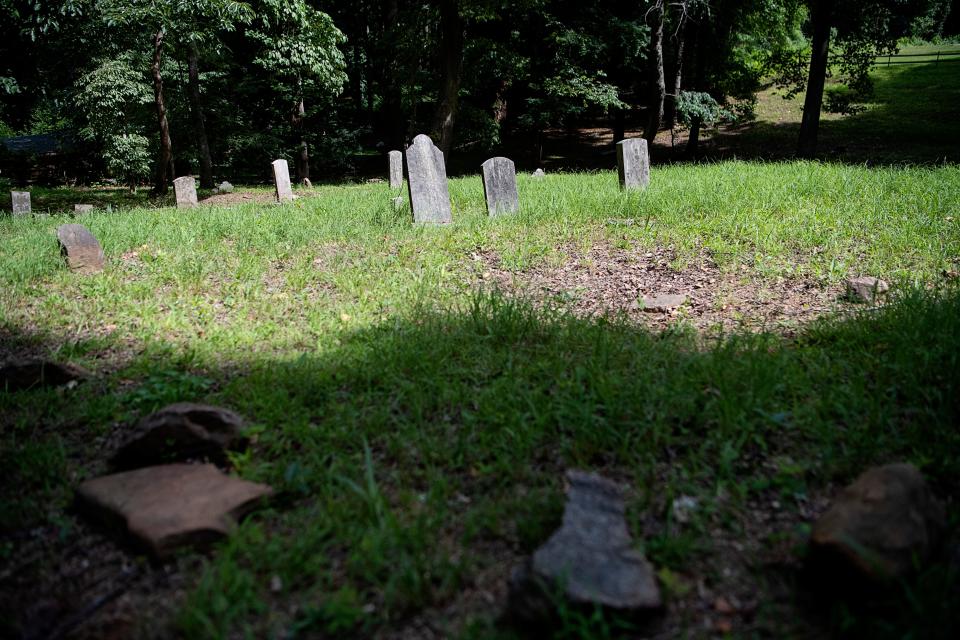Some graves are marked with headstones while others with only rocks at the South Asheville Cemetery July 5, 2023.