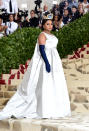 <p>Mindy Kaling could pass for a queen from Game of Thrones in this Vassilis Zoulias white gown, gold crown and black gloves. Photo: Getty Images </p>