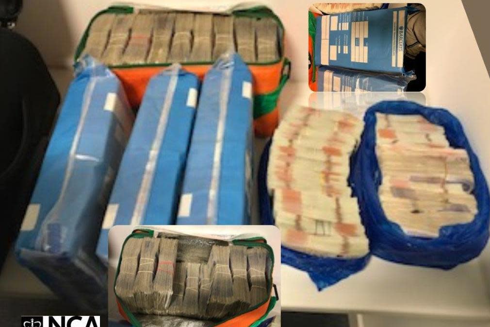 Cash recovered by officers from the National Crime Agency (NCA) during early morning raids from seven home addresses in Hounslow, Hayes, Uxbridge and Southall: PA/NCA