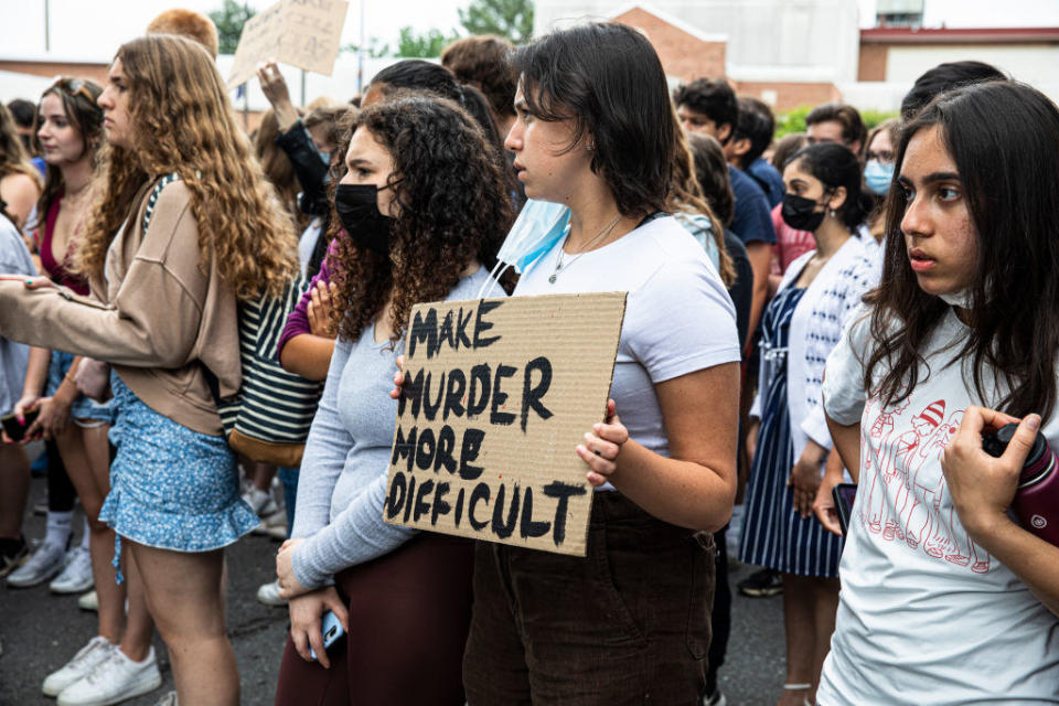 students protesting with anti-gun signs