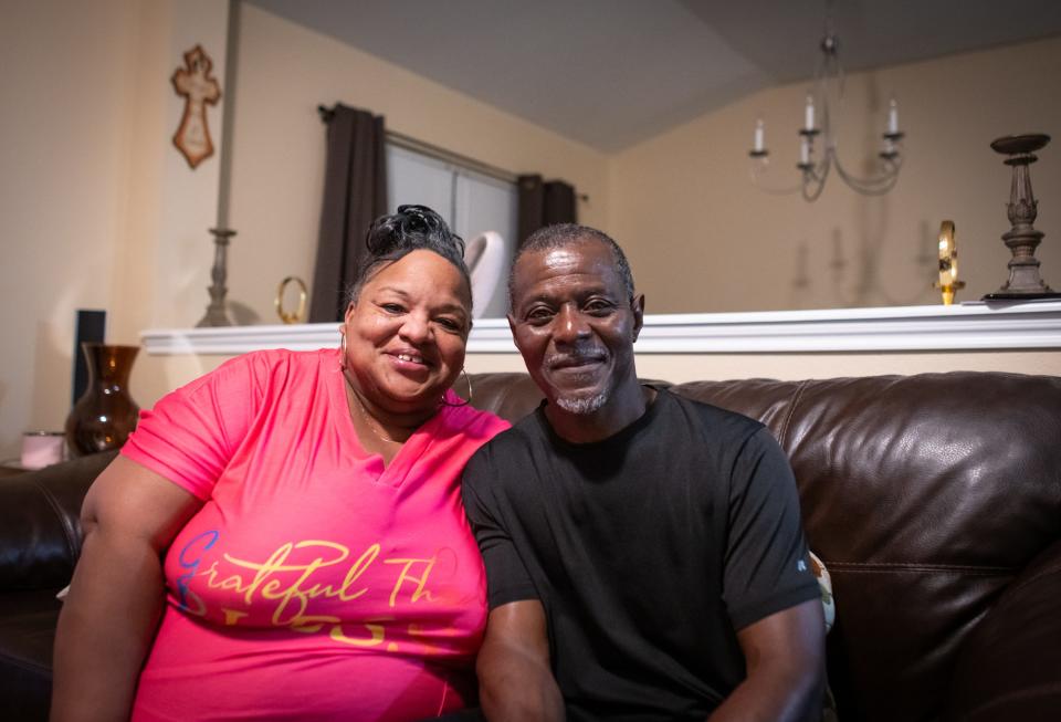 Allen Andre Cause sits with his wife, Dellanda, at their home in Elgin. He is now out on parole after 30 years in prison.