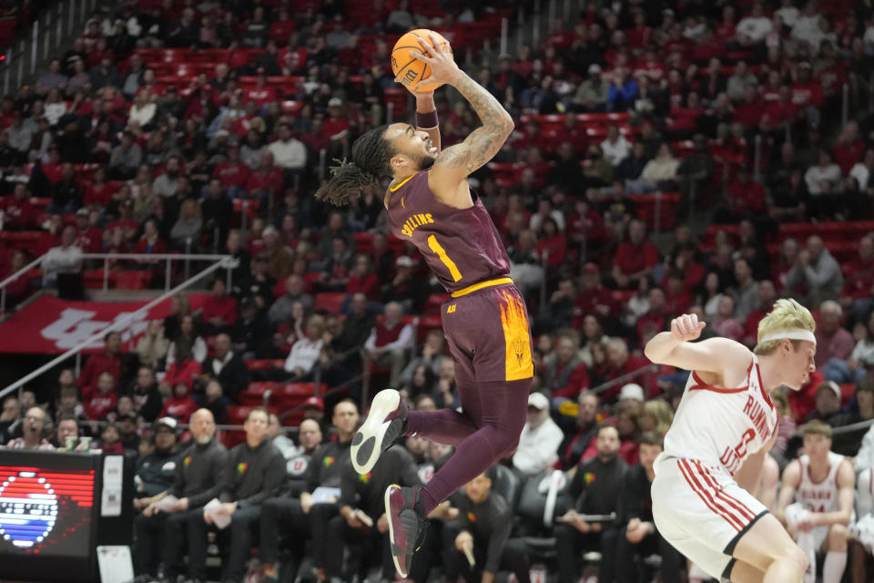 Arizona State guard Frankie Collins (1) goes to the basket, next to Utah guard Hunter Erickson (0) during the first half of an NCAA college basketball game Saturday, Feb. 10, 2024, in Salt Lake City. (AP Photo/Rick Bowmer)