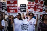 Women demand equal rights and an end to violence against women on International Women's Day in Lima