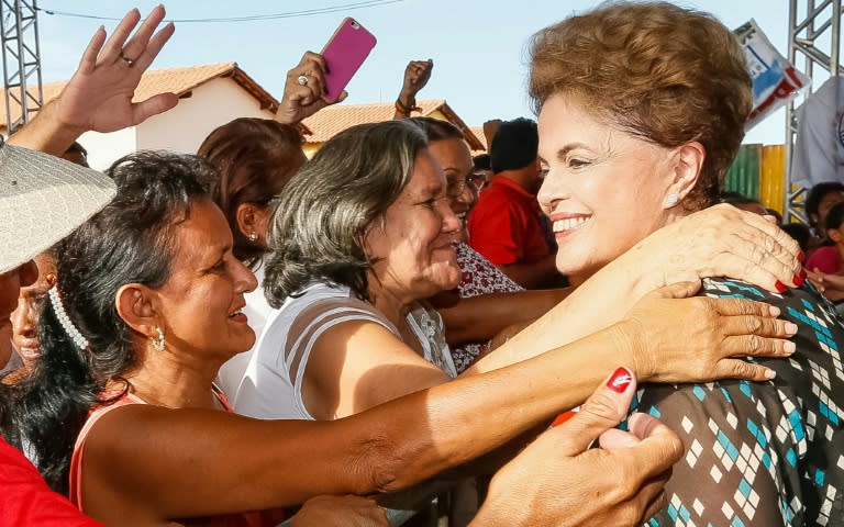 Brazilian President Dilma Rousseff (right) is greeted by supporters as she visits a housing project in Santarem, on May 5, 2016