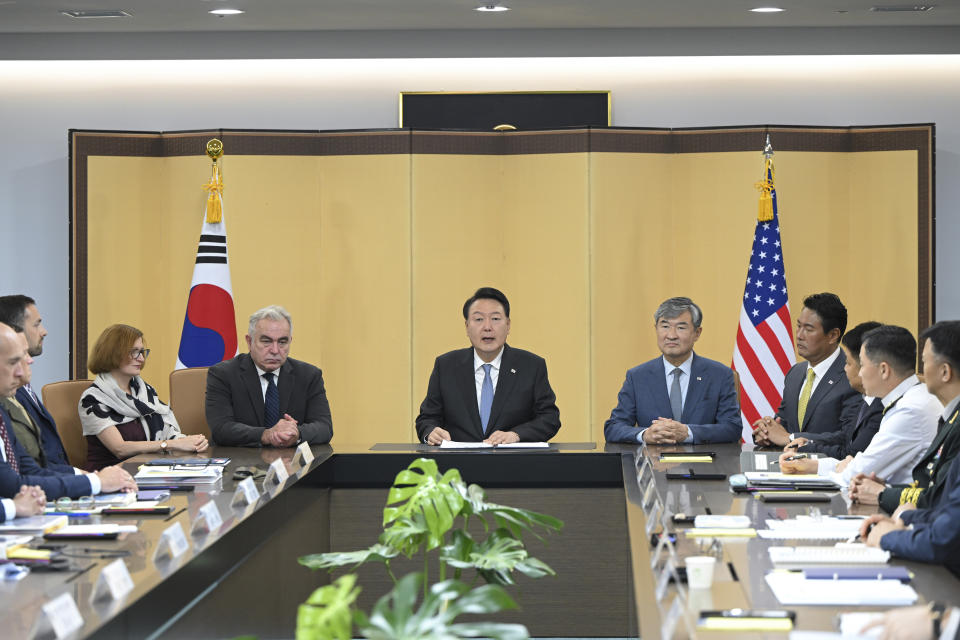 In this photo provided by South Korea Presidential House via Yonhap, South Korean President Yoon Suk Yeol, center, speaks during a meeting of the Nuclear Consultative Group between South Korea and the United States at the presidential house in Seoul, South Korea, Tuesday, July 18, 2023. Participants are U.S. National Security Coordinator for the Indo Pacific Affairs Kurt Campbell, center left, U.S. Assistant Secretary of Defense for Acquisition Cara Abercrombie, third from left, South Korea's National Security Adviser Cho Tae-yong, center right, and South Korea's deputy national security director Kim Tae-hyo, fourth from right. (South Korea Presidential House/Yonhap via AP)
