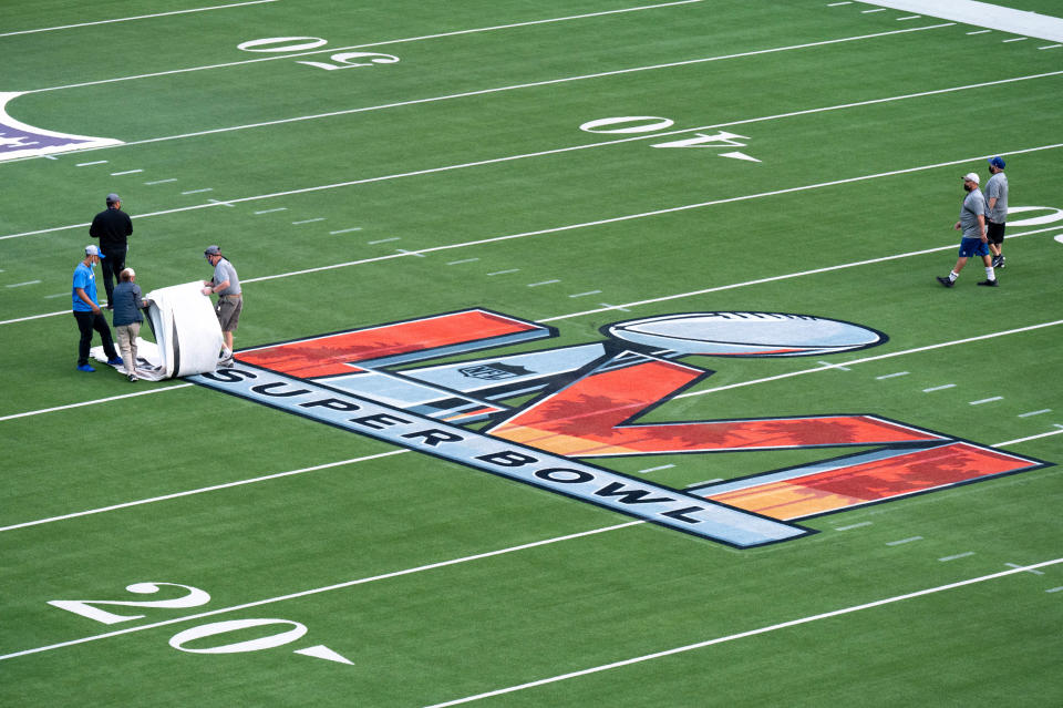 Inglewood, CA - February 12:The protective covering is peeled back for the logos on the field at SoFi Stadium in Inglewood, CA for Super Bowl LVI which will take place Sunday.    (Photo by David Crane/MediaNews Group/Los Angeles Daily News via Getty Images)