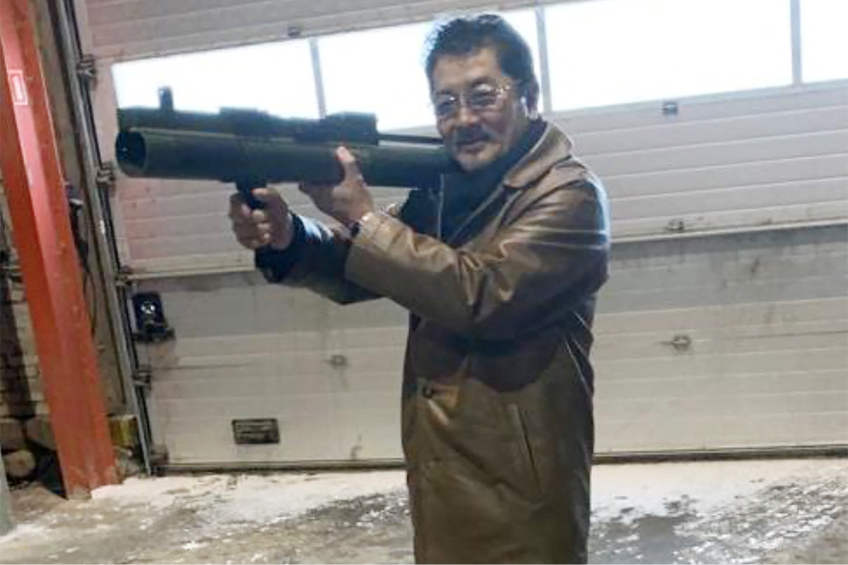 Takeshi Ebisawa poses with a rocket launcher (via REUTERS)