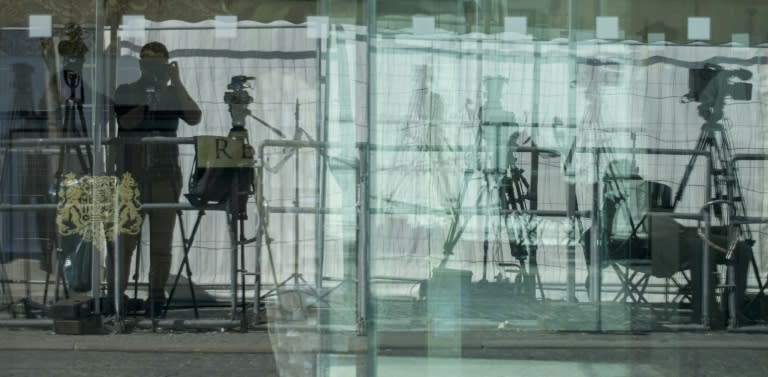 Cameras and tripods are reflect in a glass entrance of the Palais Coburg Hotel in Vienna, where the Iran nuclear talks are held, on July 3, 2015