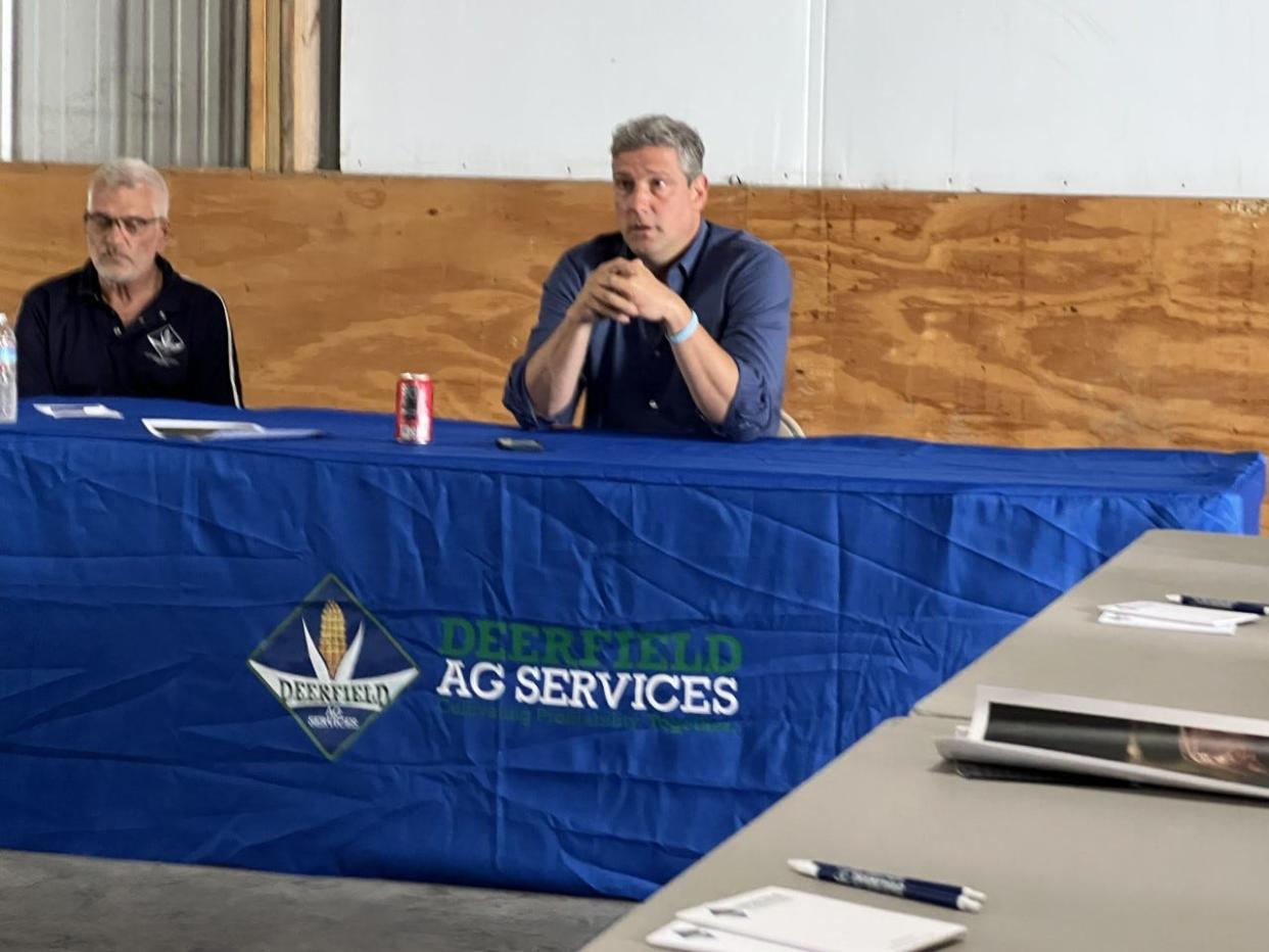 U.S. Rep. Tim Ryan, with Bill Wallbrown of Deerfield Ag Services, talks at a roundtable discussion with area farmers.
