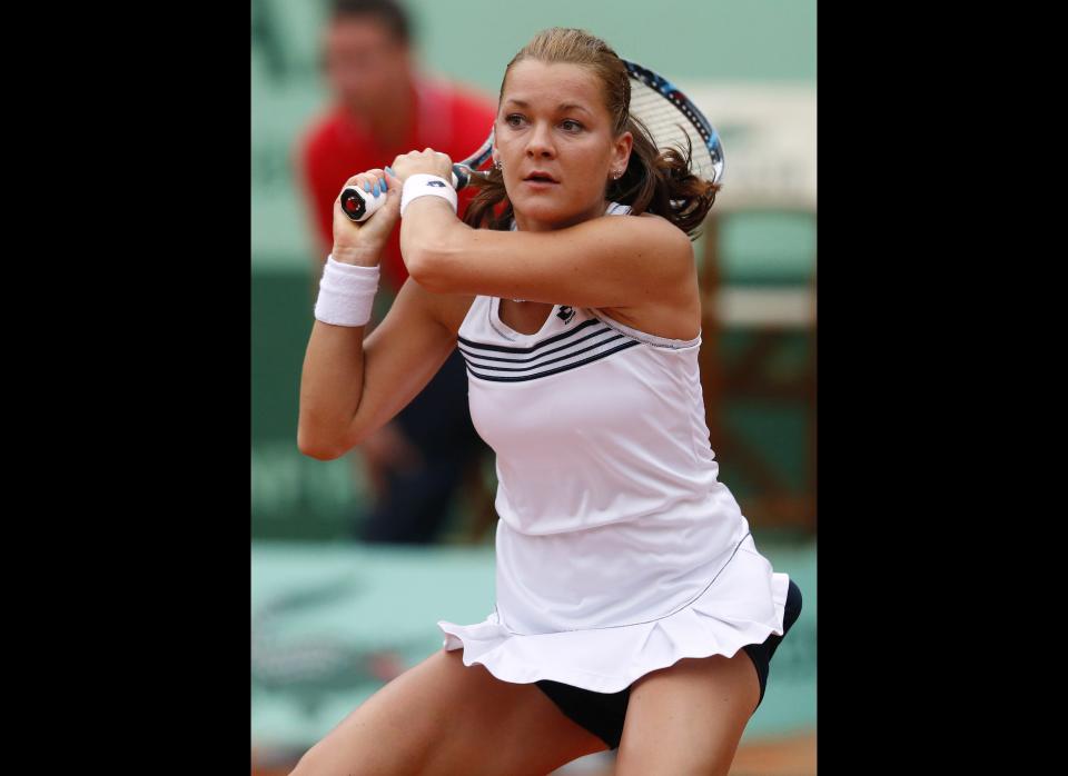 Poland's Agnieszka Radwanska hits a return to US Venus Williams during their Women's Singles 2nd Round tennis match of the French Open in Paris.       (KENZO TRIBOUILLARD/AFP/GettyImages)