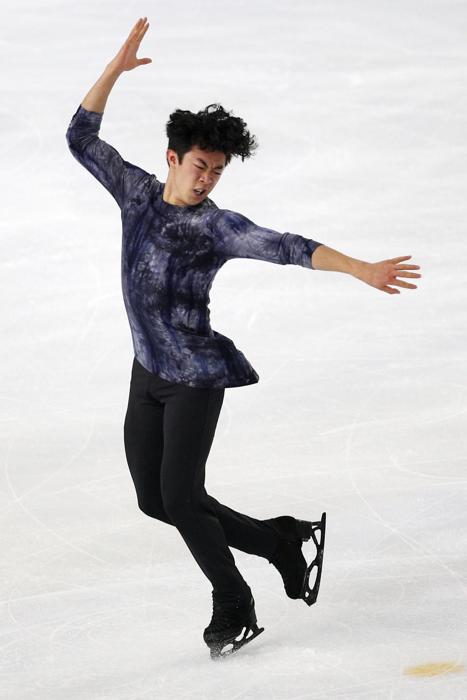 FILE - In this Saturday, Nov. 24, 2018, file photo, Nathan Chen competes in the men's free skating program during the ISU figure skating France's Trophy, in Grenoble, France. U.S. figure skater Chen will be trying to defend his Grand Prix Final title in Vancouver, British Colombia, beginning Thursday, Dec. 6, 2018. (AP Photo/Francois Mori, File)