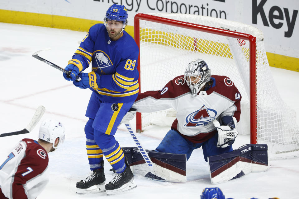 Buffalo Sabres right wing Alex Tuch (89) looks to tip the puck past Colorado Avalanche goaltender Alexandar Georgiev (40) during the third period of an NHL hockey game, Thursday, Dec. 1, 2022, in Buffalo, N.Y. (AP Photo/Jeffrey T. Barnes)