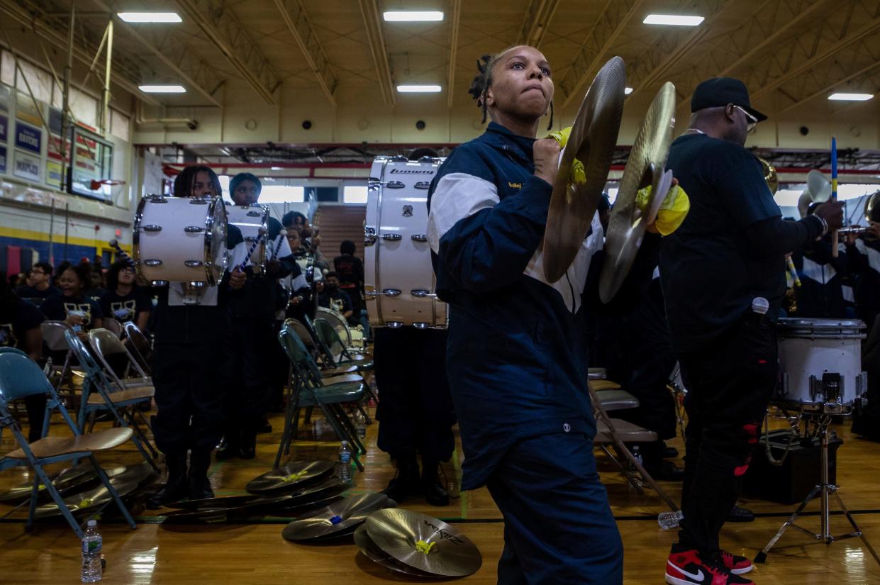 Kailei Johnson-King, a Levey Middle School marching band member, performs in front of a large crowd during the 8th annual Harvest Festival inside the University High School Academy's gymnasium in Detroit on Wednesday, Nov. 22, 2023.