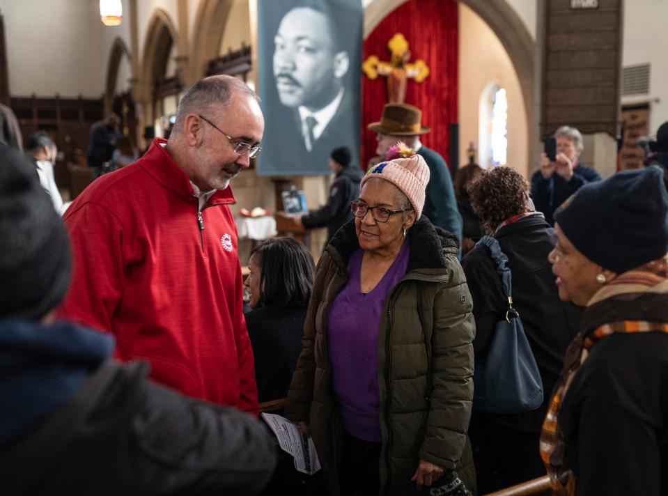 UAW president Shawn Fain, left, speaks with Marian Baker, center, of Highland Park, and Maureen Taylor, of Detroit, before the start of the 21st Detroit Martin Luther King Jr. Day rally and march at St. Matthew's & St. Joseph's Episcopal Church in Detroit on Monday, Jan. 15, 2024.