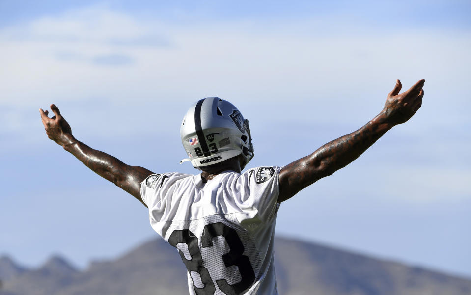 Las Vegas Raiders tight end Darren Waller reacts to teammates during an NFL football practice Saturday, July 31, 2021, in Henderson, Nev. (AP Photo/David Becker)