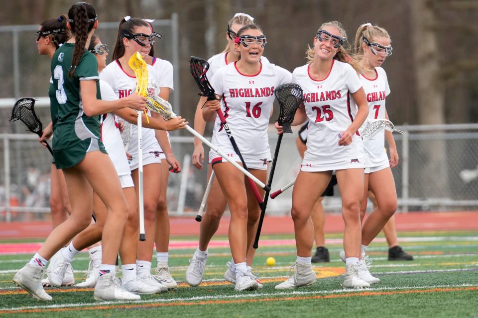 Abby Henderson (16), Annie Lish (25) and other players from Northern Highlands celebrate a goal against Ramapo. Tuesday, April 11, 2023 