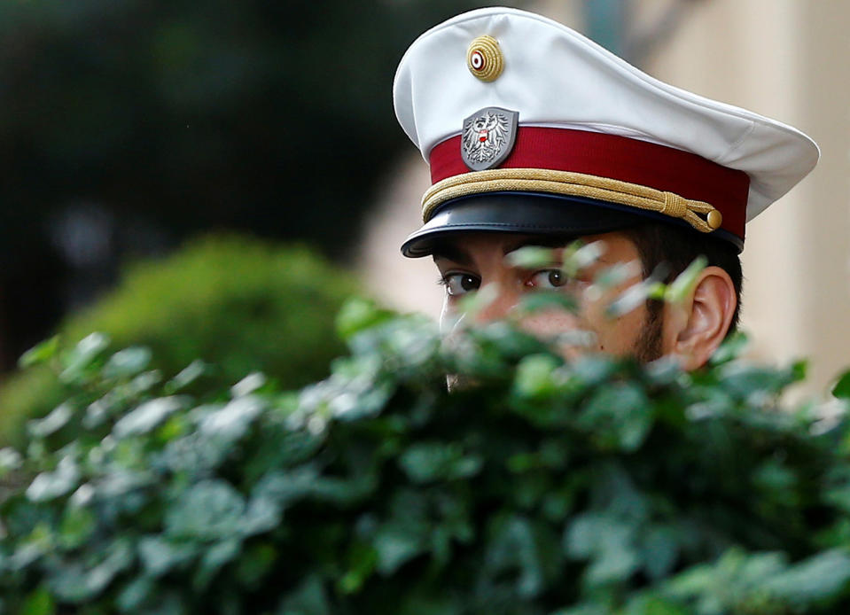 An Austrian police officer guards a hotel in Vienna