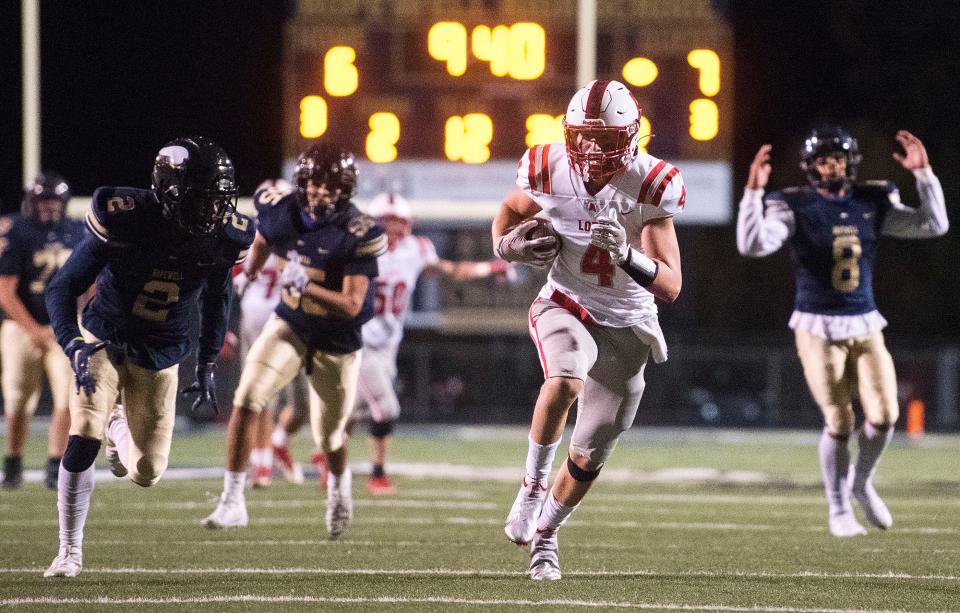 Avonworth's Peyton Faulkner (4) heads to the end zone with Hopewell's Jamar Jeter (2) on his heels during Friday night's game at Hopewell.