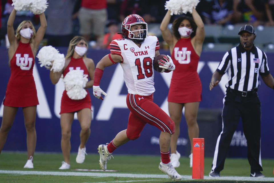 Utah wide receiver Britain Covey (18) runs to the end zone for a touchdown during the first half of an NCAA college football game against San Diego State Saturday, Sept. 18, 2021, in Carson, Calif. (AP Photo/Ashley Landis)