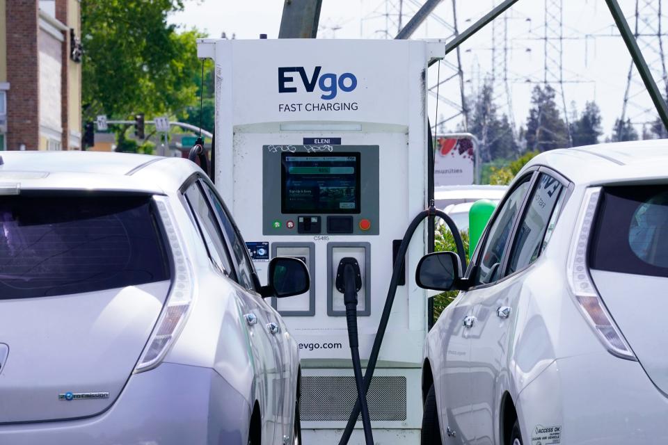 Electric cars are parked at a charging station in Sacramento on April 13. If you're considering buying a car, it may be best to wait, Bob Peralta, a Stockton-based auto broker, said.