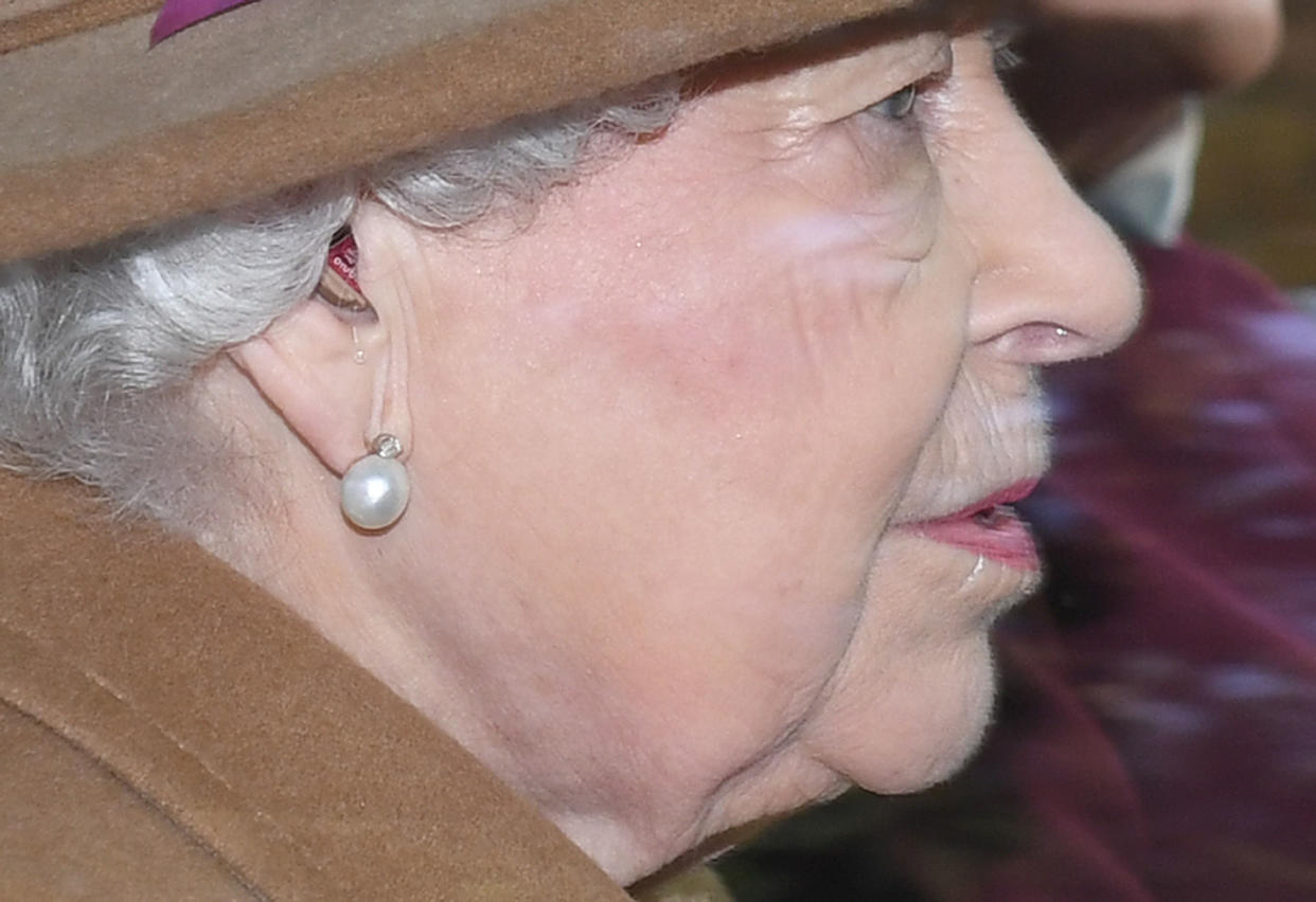 A hearing aid is visible as the Queen Elizabeth II arrives to attend a morning church service at St Mary Magdalene Church in Sandringham, Norfolk. PA Photo. Picture date: Sunday January 12, 2020. Photo credit should read: Joe Giddens/PA Wire