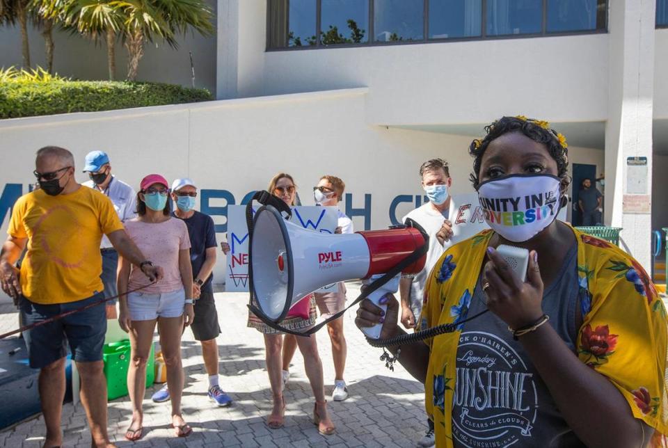 Cynietra Copeland, a Miami Beach resident of 11 years, speaks at a resident rally outside City Hall to protest the city’s handling of spring break on Saturday March 27, 2021.