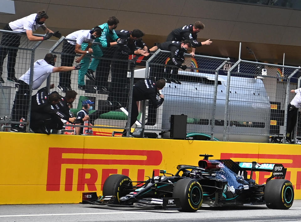 People take pictures as Mercedes' British driver Lewis Hamilton wins the Formula One Styrian Grand Prix race on July 12, 2020 in Spielberg, Austria. (Photo by Joe Klamar / various sources / AFP) (Photo by JOE KLAMAR/AFP via Getty Images)