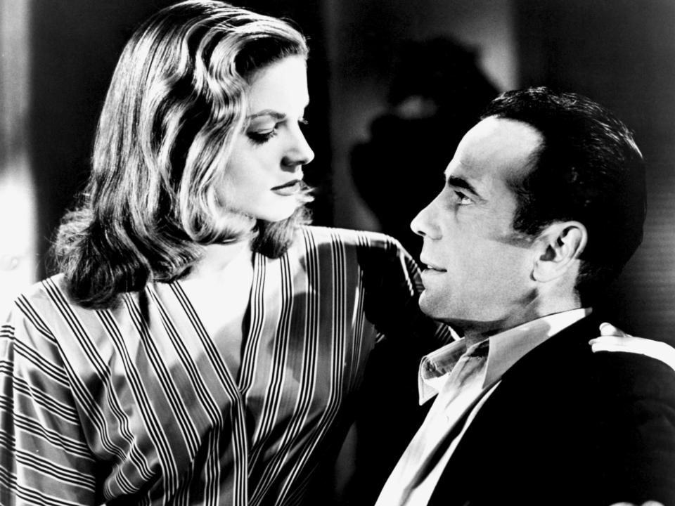 Actors Humphrey Bogart and Lauren Bacall pose for a studio publicity Still to promote their movie 'To Have And Have Not'