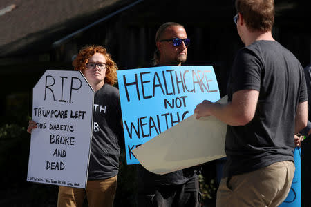 FILE PHOTO: The SoCal Health Care Coalition protests U.S. President Donald Trump's executive order on healthcare at UC San Diego in La Jolla, California, U.S., October 12, 2017. REUTERS/Mike Blake/File Photo