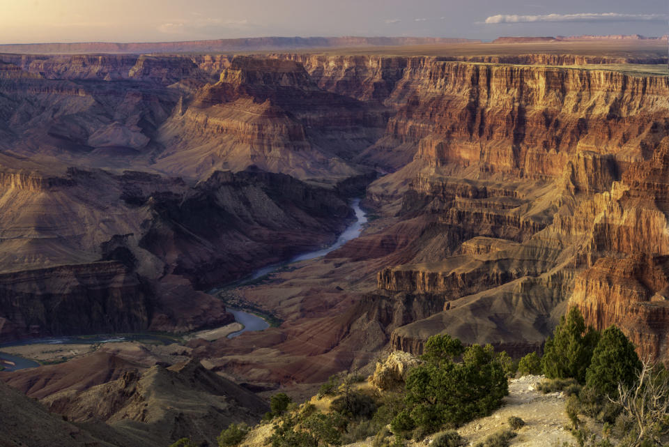 Water coursing through the grand Canyon after sunset.