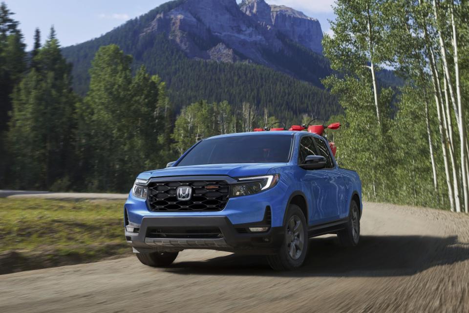 This photo provided by Honda shows the 2024 Ridgeline. A TrailSport version is new this year and it exclusively comes with all-terrain tires, underbody skidplates and an off-road-tuned suspension. (American Honda Motor Co. via AP)