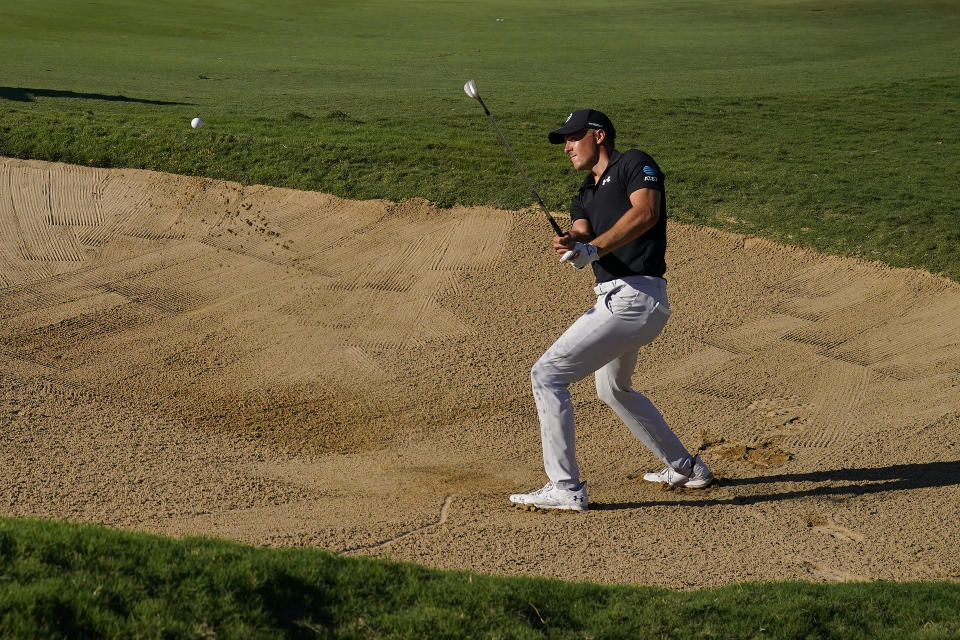 Jordan Spieth plays a shot from a bunker on the 14th hole during the first round of the Tournament of Champions golf event, Thursday, Jan. 5, 2023, at Kapalua Plantation Course in Kapalua, Hawaii. (AP Photo/Matt York)