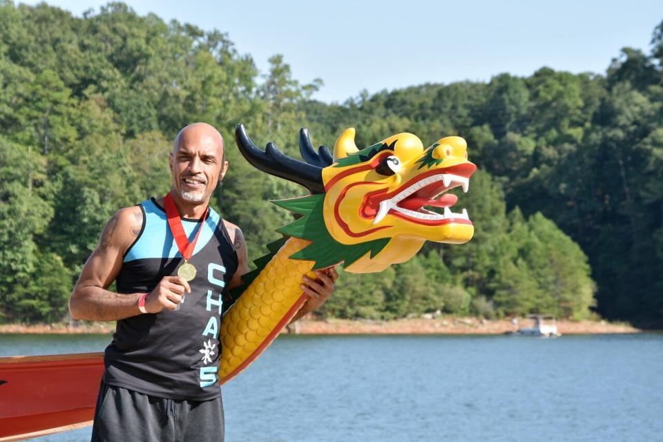 Man with medal and dragon boat