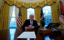U.S. President Donald Trump sits at the Resolute Desk during an interview with Reuters at the White House in Washington, U.S., January 17, 2018. REUTERS/Kevin Lamarque