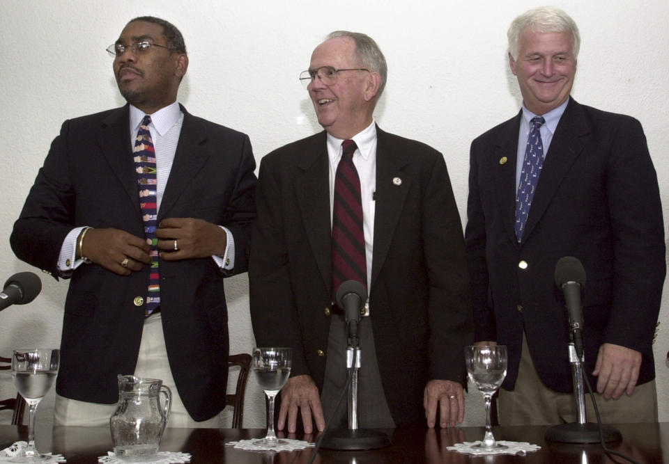 FILE - In this Oct. 23, 2003 file photo, U.S. Congressmen Gregory W. Meeks (D-NY), left, Cass Ballenger (D-NC), center, and William D. Delahunt (D-MA), smile after giving a news conference in the home of US ambassador to Venezuela in Caracas, Venezuela. Meeks, the new chairman of the House Foreign Affairs Committee under the Joe Biden administration in 2021, is likely to be a key interlocutor for the incoming administration’s efforts to de-escalate tensions with Venezuela. “Maduro doesn’t trust his own shadow. But he might trust Gregory Meeks,” said Delahunt. (AP Photo/Leslie Mazoch, File)