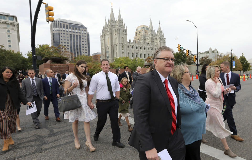People arrive for the twice-annual conference of The Church of Jesus Christ of Latter-day Saints Saturday, Oct. 6, 2018, in Salt Lake City. (AP Photo/Rick Bowmer)