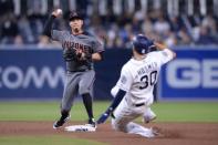Apr 1, 2019; San Diego, CA, USA; Arizona Diamondbacks second baseman Wilmer Flores (left) forces out San Diego Padres first baseman Eric Hosmer (30) at second base before throwing to first base to complete the double play during the eighth inning at Petco Park. Mandatory Credit: Orlando Ramirez-USA TODAY Sports