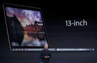 Philip W. Schiller, Senior Vice President of worldwide marketing at Apple Inc, announces a new Mac Book during an Apple event in San Francisco, California October 22, 2013. REUTERS/Robert Galbraith