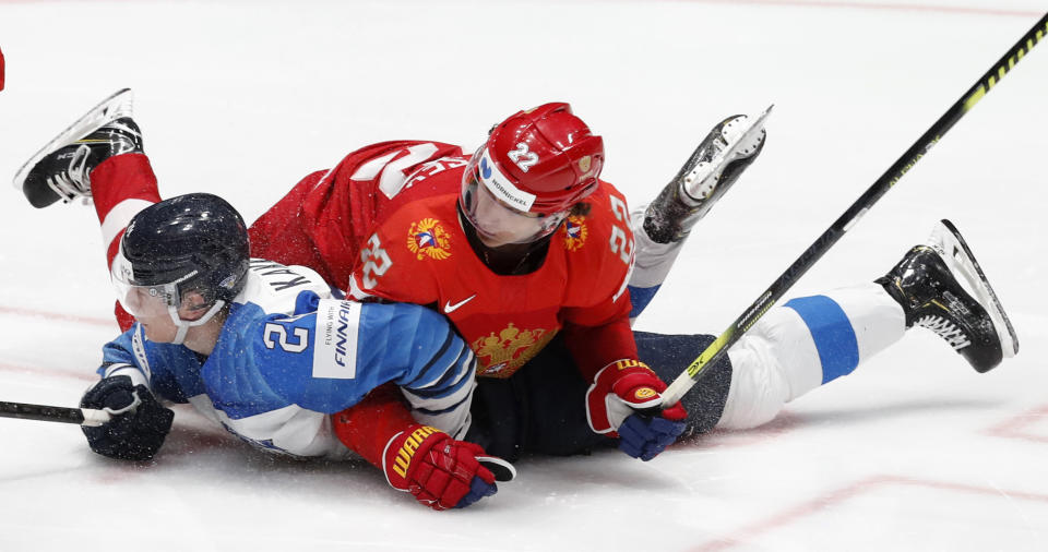 Finland's Kaapo Kakko, left, collides with Russia's Nikita Zaitsev, right, during the Ice Hockey World Championships semifinal match between Russia and Finland at the Ondrej Nepela Arena in Bratislava, Slovakia, Saturday, May 25, 2019. (AP Photo/Petr David Josek)