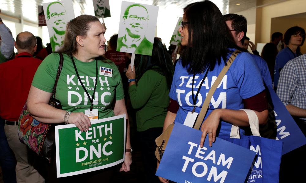 Supporters Keith Ellison and Tom Perez, candidates for Democratic National Committee chairman, speak to each other during a DNC forum in Baltimore.