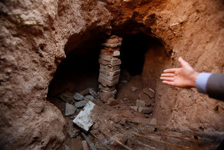 Archaeologist Musab Mohammed Jassim shows artefacts and archaeological pieces in a tunnel network running under the Mosque of Prophet Jonah, Nabi Yunus in Arabic, in eastern Mosul, Iraq March 9, 2017. REUTERS/Suhaib Salem