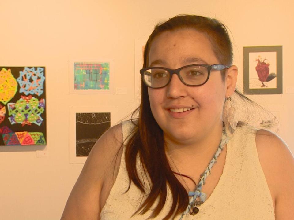 Ella Guirguis displayed two works of art this weekend at the Centre for Autism Services Alberta’s Annual Art Show and Sale. (Scott Neufeld/CBC - image credit)
