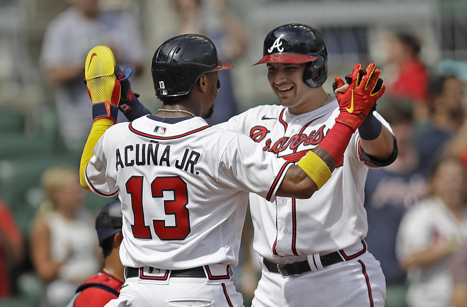 Atlanta Braves' Austin Riley, right, celebrates with Ronald Acuna Jr. (13) after hitting a two-run home run off Washington Nationals' Patrick Corbin in the first inning of a baseball game Saturday, July 9, 2022, in Atlanta. (AP Photo/Ben Margot)