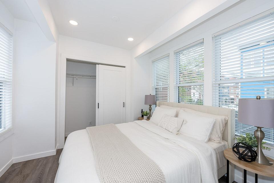 A bedroom in a skinny home.