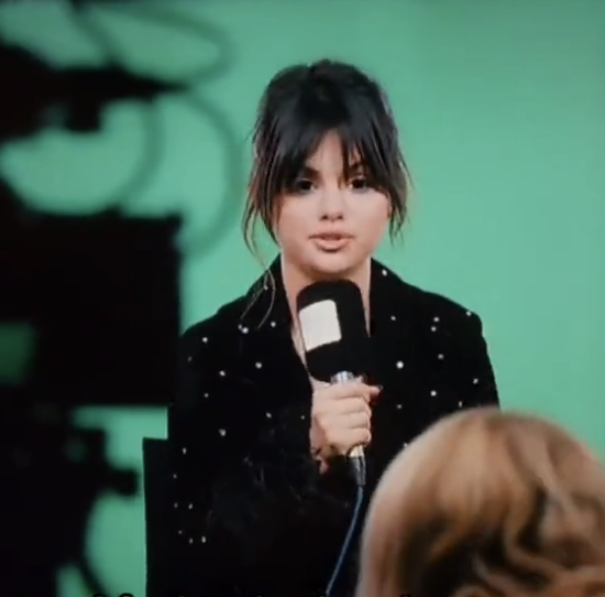 selena talking into a mic