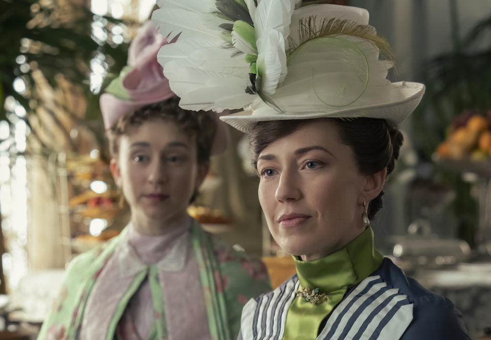 Taissa Farmiga and Carrie Coon in 'The Gilded Age,' wearing very tall hats