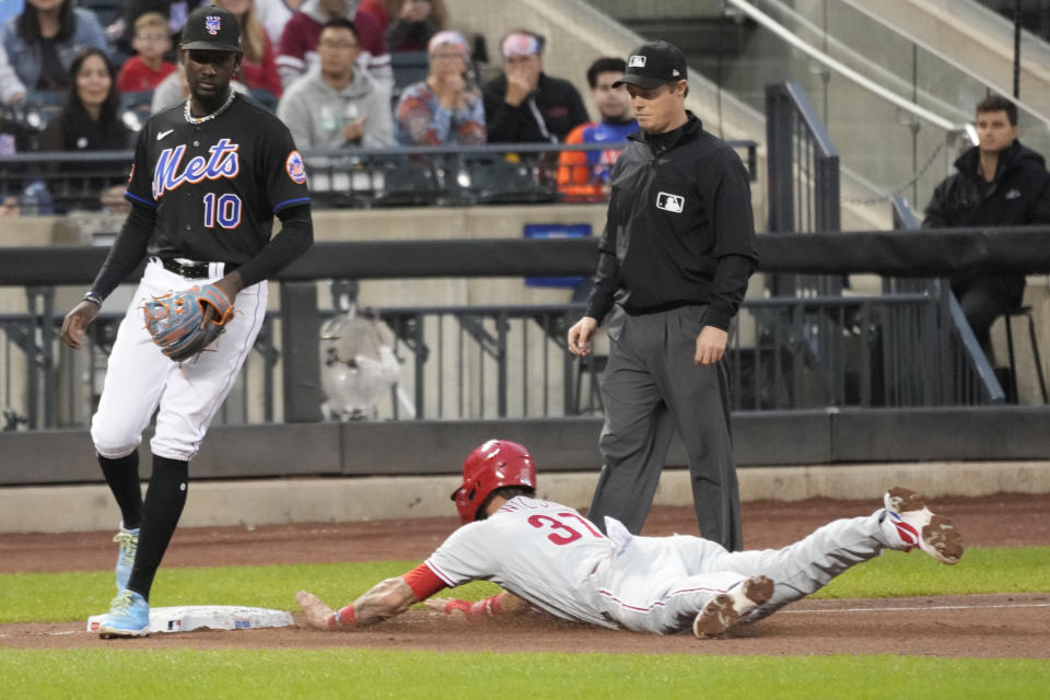 Philadelphia Phillies' Weston Wilson (37) steals third past New York Mets third baseman Ronny Mauricio (10) during the ninth inning of the first game of a baseball doubleheader, Saturday, Sept. 30, 2023, in New York. (AP Photo/Mary Altaffer)